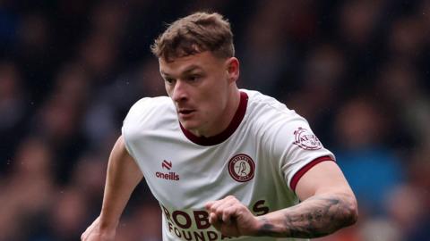 Cameron Pring playing for Bristol City in a white away shirt