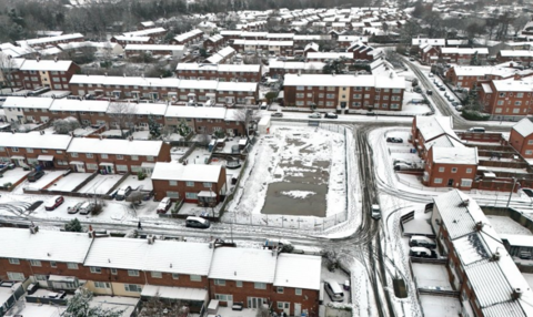 Snow on the roofs of houses in the Lee Park area of Liverpool