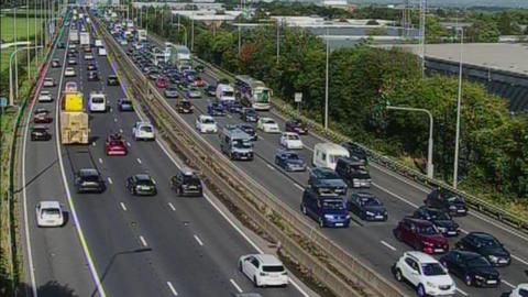 A still taken from Traffic England cameras showing a busy motorway in both direction