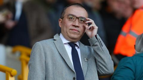 Jeff Shi looks at the pitch from the Molineux stands.