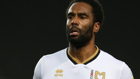 Cameron Jerome in action for MK Dons