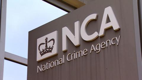 National Crime Agency (NCA) headquarters building sign on Tinworth Street in Vauxhall, London.