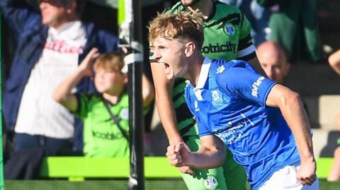 Callum McFarlane celebrates scoring a goal during his loan spell with Wealdstone