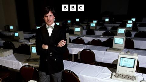 Steve jobs in front of a room full of computers - 1984.