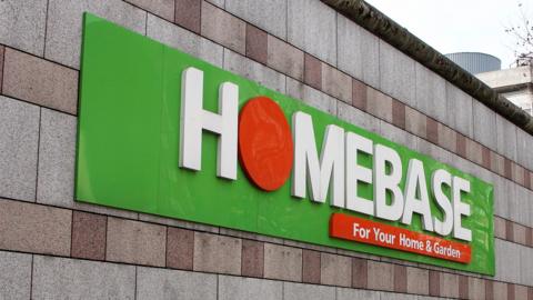 A large Homebase sign attached to a wall