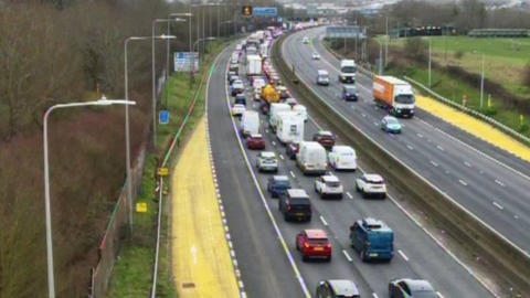 An image from a traffic camera showing a long queue of traffic on the M5.