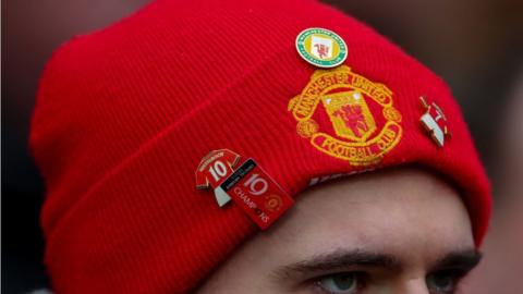 Manchester United fan in hat