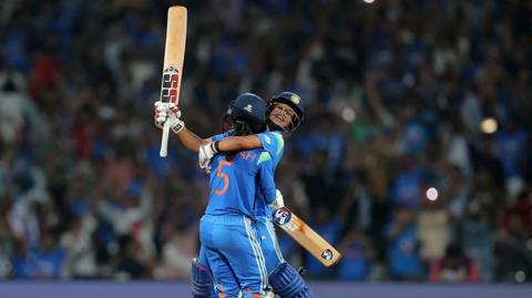 Jemimah Rodrigues and Amanjot Kaur celebrate beating Australia in the semi-final of the Women's World Cup