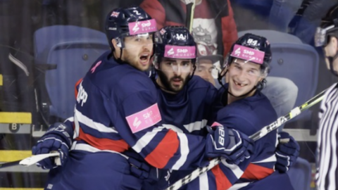 Great Britain players celebrate during their game against Latvia earlier this year