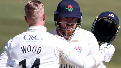 Danny Lamb celebrates with Luke Wood.