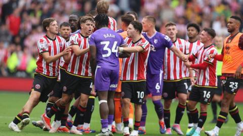 Sheffield United and Watford players confront one another