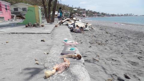 Salvaged toys lie by the beach in Scott's Head