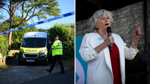 The image is a split composition showing two unrelated scenes placed side‑by‑side. On the left, a UK police incident is unfolding: a white‑and‑yellow police van with the registration FV24 GYW is parked on what appears to be a residential driveway or rural lane, with blue‑and‑white police tape cordoning off the area and a high‑visibility‑jacketed officer walking nearby. On the right, Anne Widdecombe stands on a stage or platform, speaking into a microphone while wearing a white jacket over a red top with a blue circular badge pinned to it; the dark background isolates the speaker and implies a public address, community event or formal announcement.
