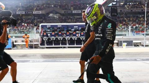 Lewis Hamilton walking back to the Mercedes garage after being eliminated from qualifying for the Abu Dhabi Grand Prix.