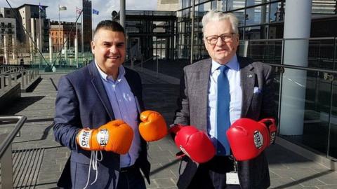 Neil McEvoy and Lord Elis-Thomas wearing boxing gloves