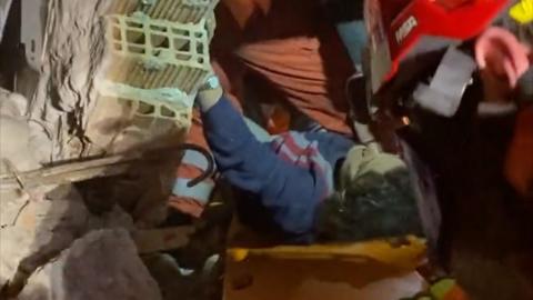 Woman pulled from the rubble of collapsed building