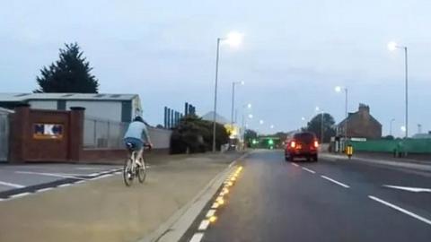 Studs and cyclist on Stoneferry Road, Hull