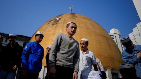 Muslims attend Eid al-Fitr prayers, to mark the end of the holy fasting month of Ramadan at a mosque in Shanghai, China