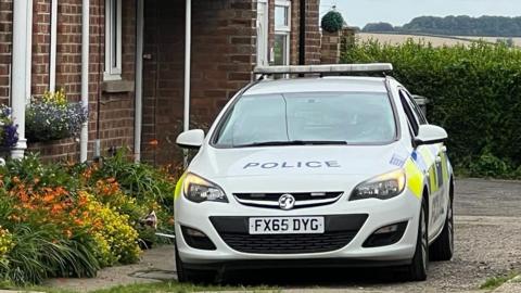 Police car at scene