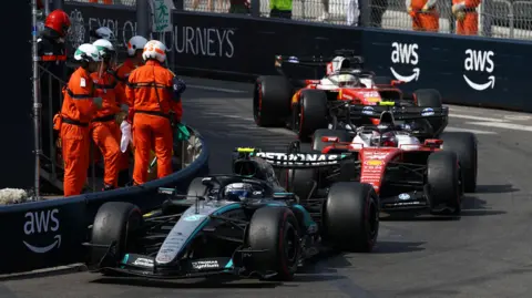 Kimi Antonelli with Lewis Hamilton and Charles Leclerc right behind him at the Monaco Grand Prix