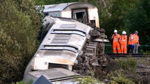 Emergency services attend a train derailment outside Lewes station in East Sussex on August 13, 2026 in Lewes, England.