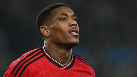 Anthony Martial looks on