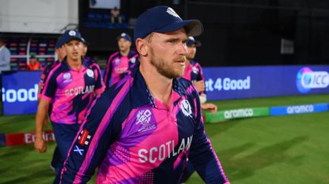Richie Berrington leads his Scotland players out during a match at the 2024 T20 World Cup against Australia 