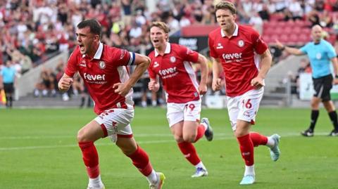 Jason Knight celebrates Bristol City's opener with teammates