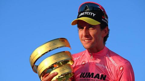 Simon Yates holds the Giro d'Italia trophy