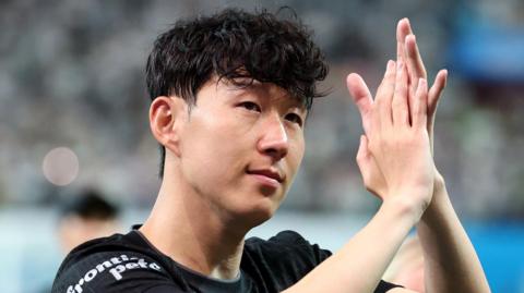 Son Heung-min applauds supporters at Seoul World Cup Stadium after playing his final game for Tottenham