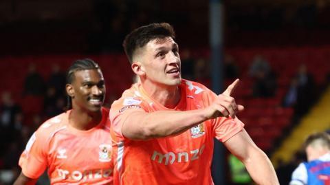 Bobby Thomas celebrates scoring Coventry's equaliser at Blackburn