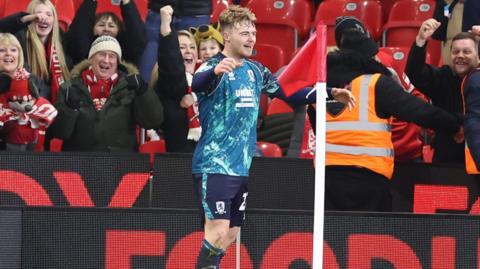 Tommy Conway celebrates scoring in front of the travelling Middlesbrough fans