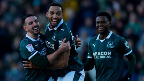 Plymouth players celebrate