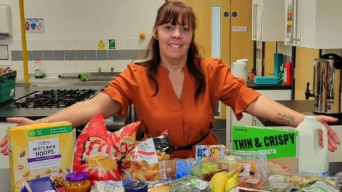 Michaela Martindale with a food parcel they have been giving to Bedford families