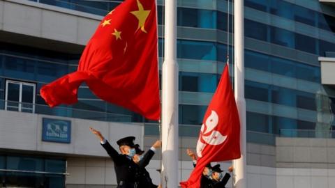 Police raise Chinese and HK flags