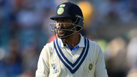 India's Ravindra Jadeja walks back after being dismissed