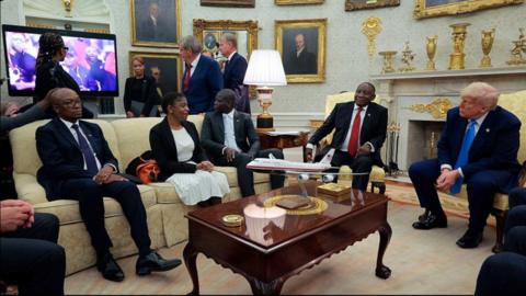 President of South Africa Cyril Ramaphosa (2nd-R) and US President Donald Trump (R) look on as a video plays in the Oval Office of the White House 