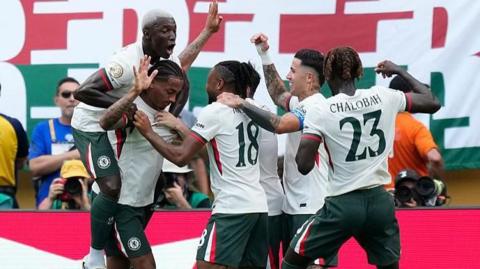 Chelsea players celebrating a goal against Fluminense 
