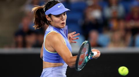 Emma Raducanu hits a forehand