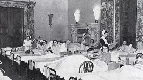 A black and white photo of the wartime maternity ward