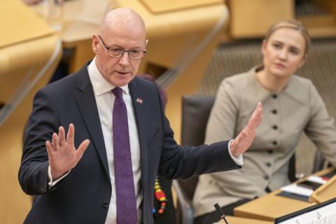 John Swinbet standing in the Holyrood chamber
