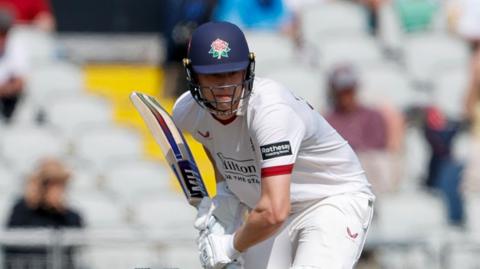 Rocky Flintoff batting for Lancashire at Northants as he prepares to play a front-foot shot