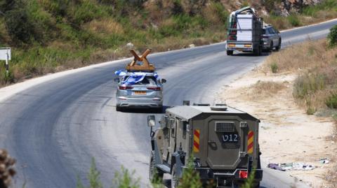 Israeli settlers move into the former Israeli settlement of Kadim near the West Bank city of Jenin, 20 August 2026.