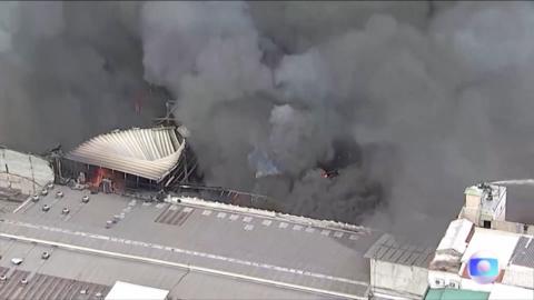 Aerial view of thick smoke rising from building