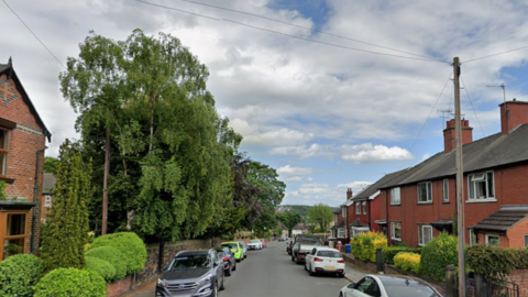 A row of houses either side of a residential street