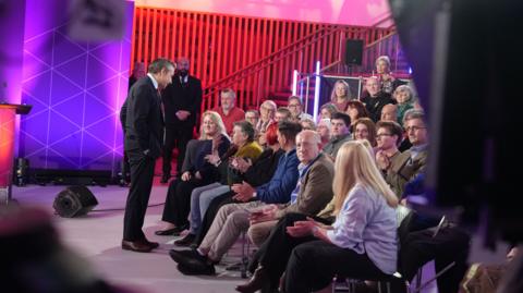 Nick Servini speaking to the audience