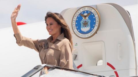 Melania Trump waves as she lands in Malawi