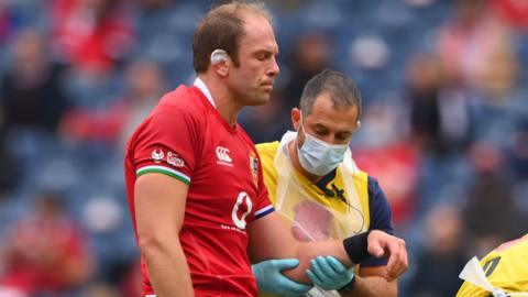 Alun Wyn Jones looks disappointed as he is taken from the field with a dislocated shoulder