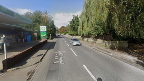 A Google Maps screengrab showing London Road in Stroud. The image shows cars driving down a road with lots of trees and the BP Garage on the left.