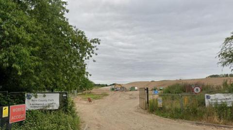 Entry to future country park with landscaping work in the distance